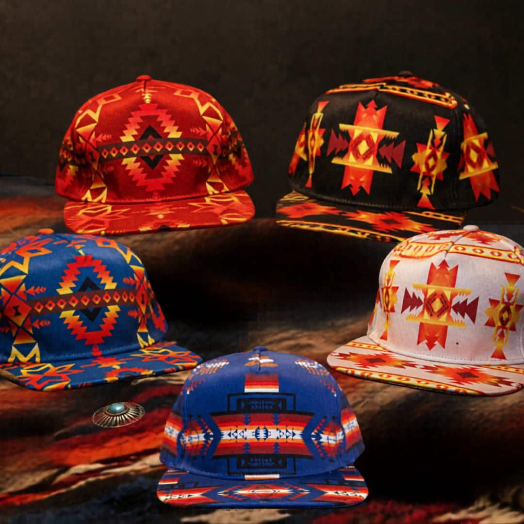 Collection banner featuring colorful Southwest-inspired flat bill hats with bold geometric Native-style patterns in blue, red, black, and white displayed on a rustic blanket background for All Nations Designs & More hats collection.