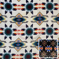 White Star reversible blanket with repeating star motifs and a small inset of the black patterned reverse.