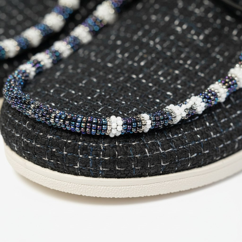 All Nations Designs &amp; More hand-beaded black mesh Hey Dude slip-on shoes with intricate white and iridescent beadwork.