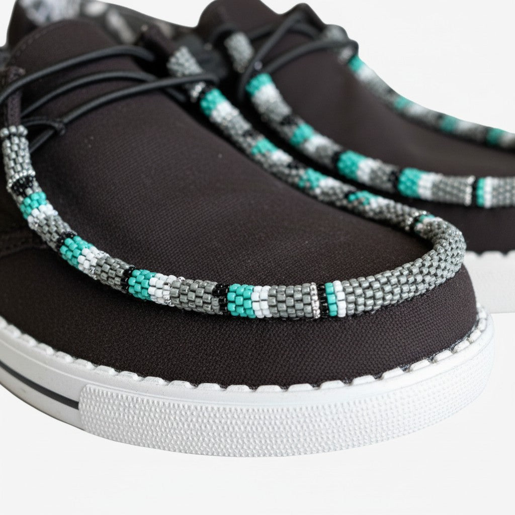 All Nations Designs &amp; More black mesh Hey Dude slip-on shoes featuring custom turquoise, grey, and white hand-beading.