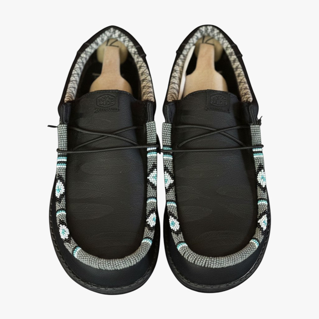 All Nations Designs & More men's black Hey Dude slip-on shoes featuring unique hand-beaded western-style detailing.