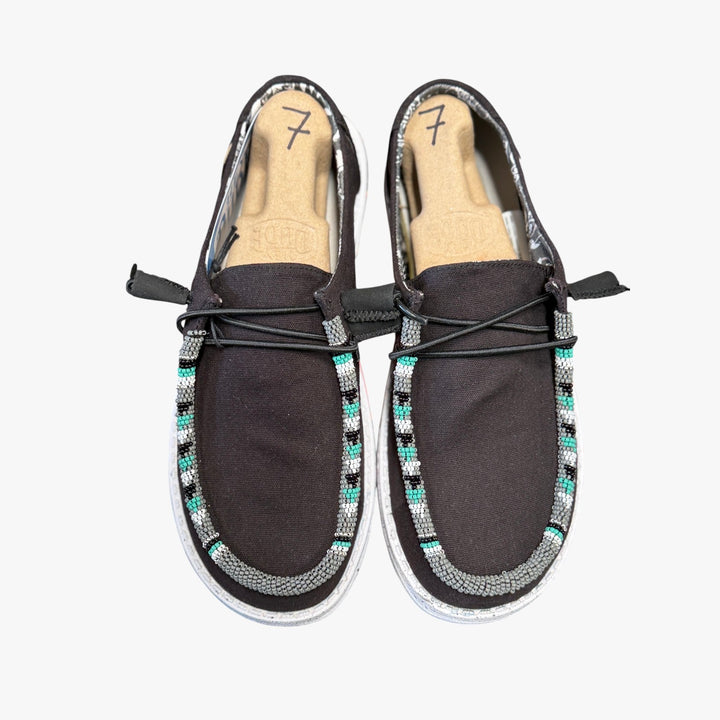 All Nations Designs &amp; More black Hey Dude slip-on shoes featuring custom hand-beaded trim in turquoise and grey