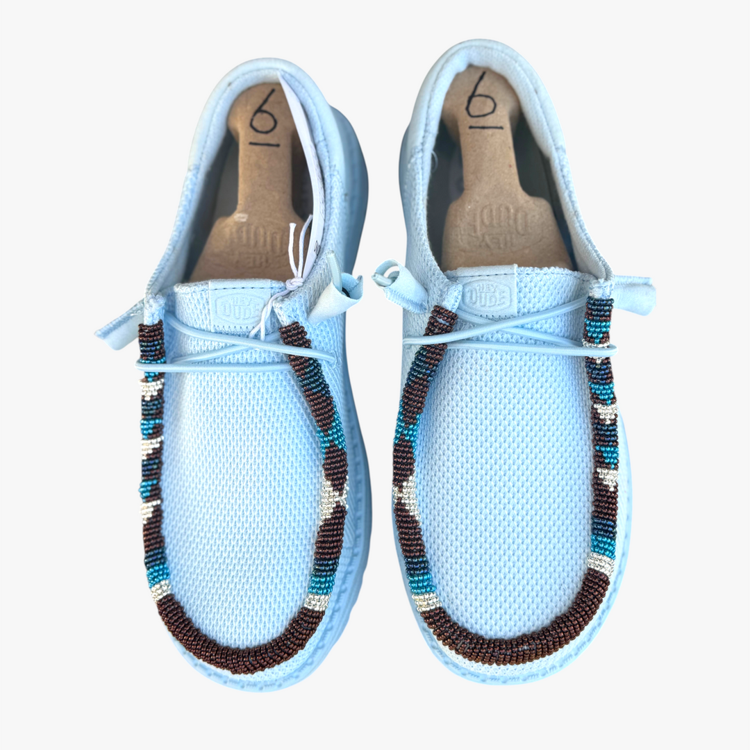 All Nations Designs &amp; More hand-beaded light blue Hey Dude mesh slip-on shoes with western-inspired beadwork detail.