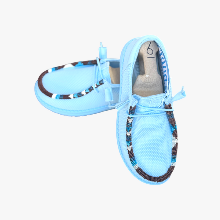 All Nations Designs &amp; More light blue mesh slip-on shoes featuring unique hand-beaded western-inspired detailing.