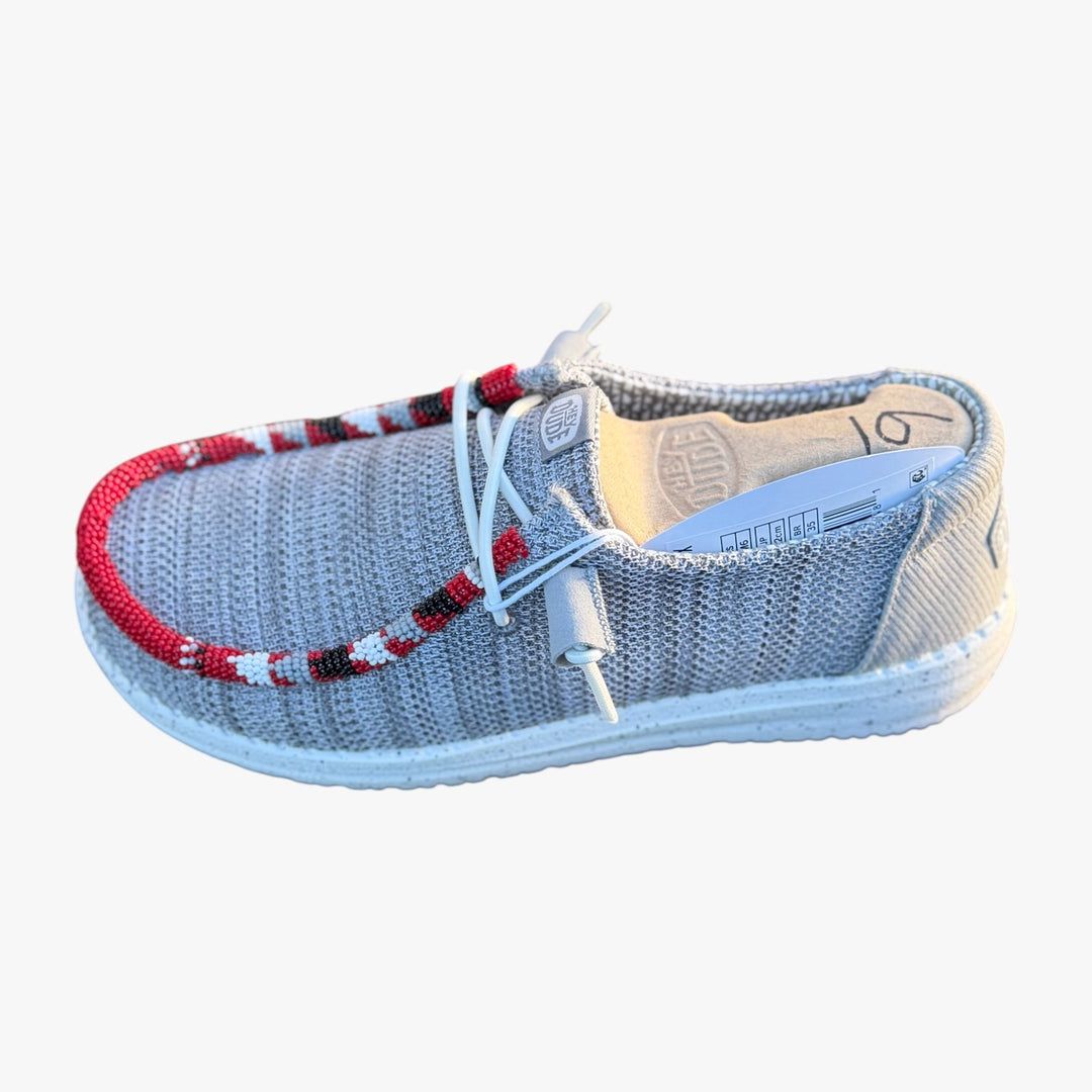 All Nations Designs &amp; More gray mesh Hey Dude slip-on shoes featuring custom red, white, and black hand-beaded trim.