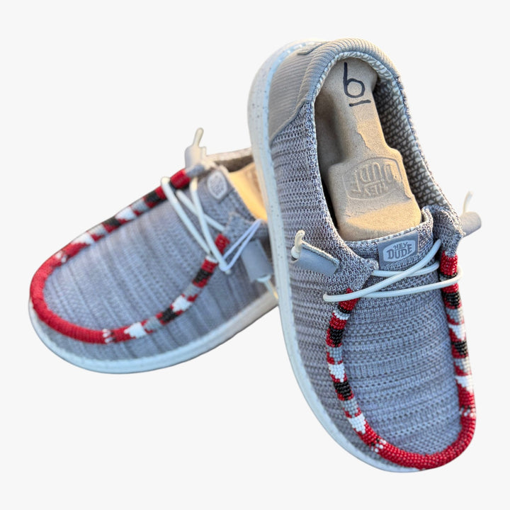 All Nations Designs &amp; More gray mesh Hey Dude slip-on shoes featuring custom red, white, and black hand-beaded trim.