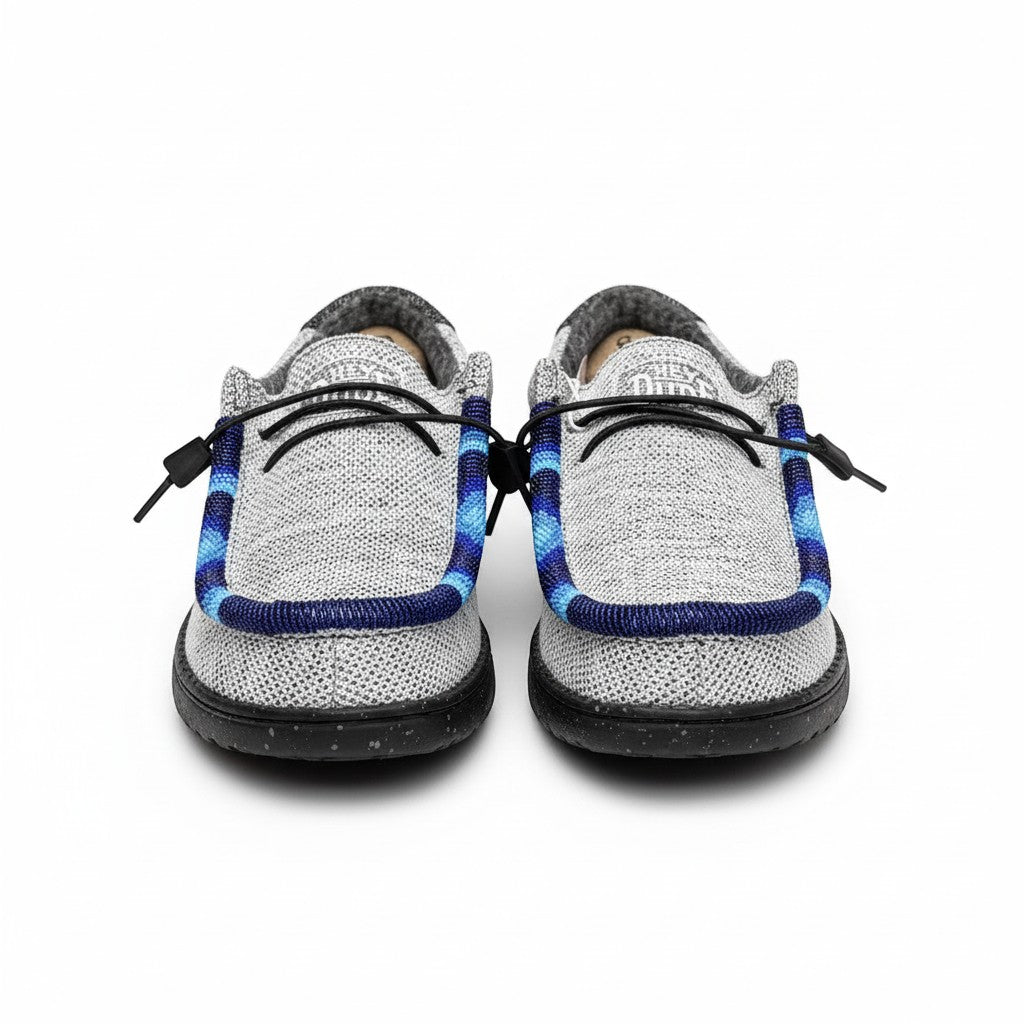 All Nations Designs &amp; More light gray mesh slip-on shoes featuring unique blue and black hand-beaded trim details.