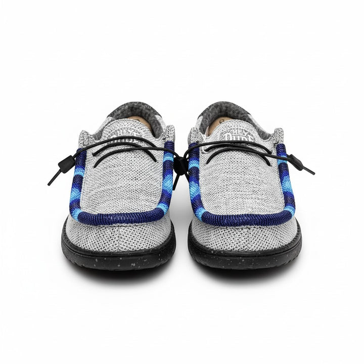 All Nations Designs &amp; More light gray mesh slip-on shoes featuring unique blue and black hand-beaded trim details.