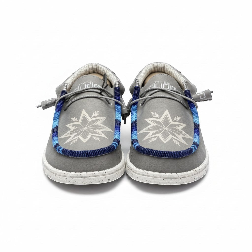 All Nations Designs &amp; More light gray Hey Dude slip-on shoes featuring custom blue hand-beaded trim and star design.
