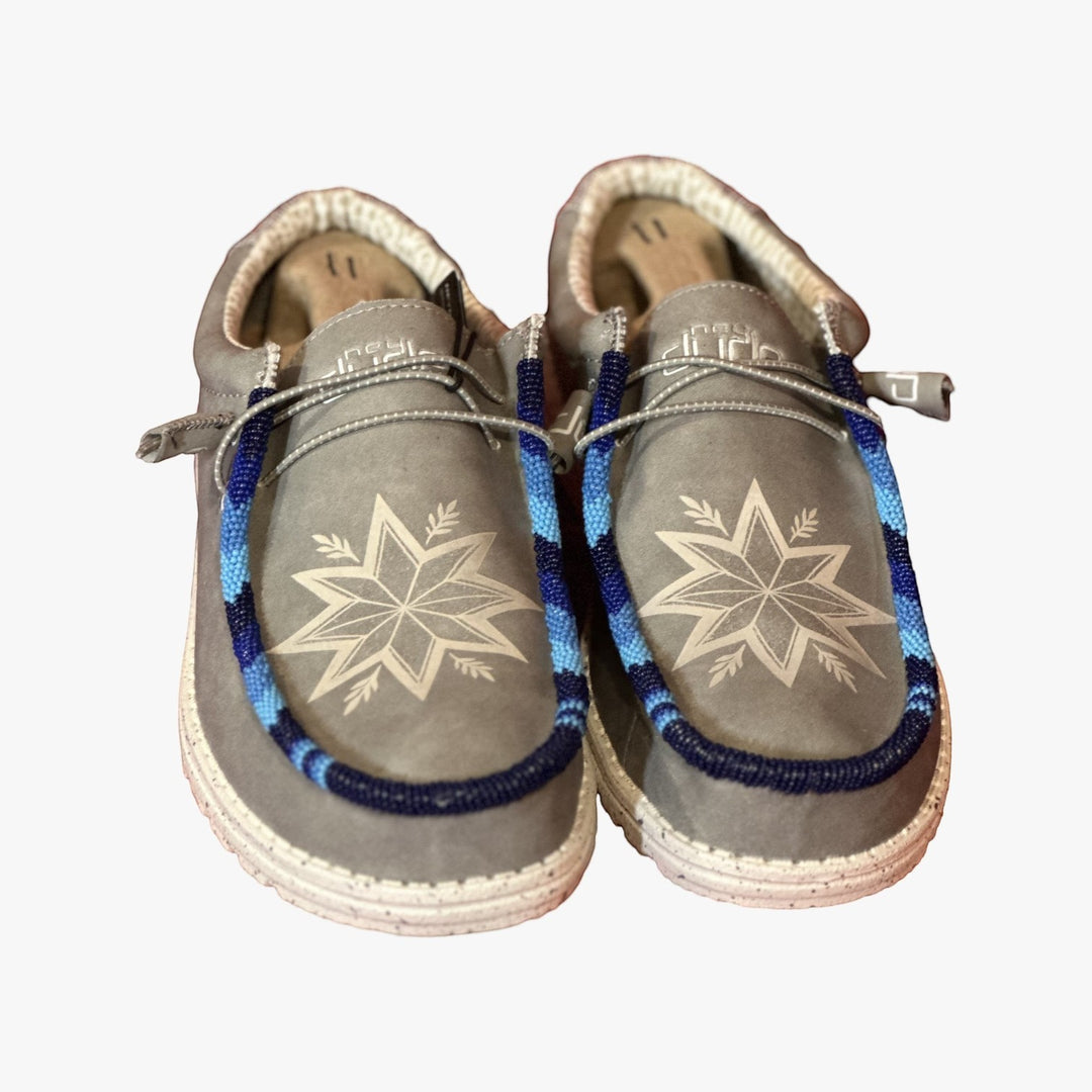 All Nations Designs &amp; More light gray Hey Dude slip-on shoes featuring custom blue and white hand-beaded star patterns.