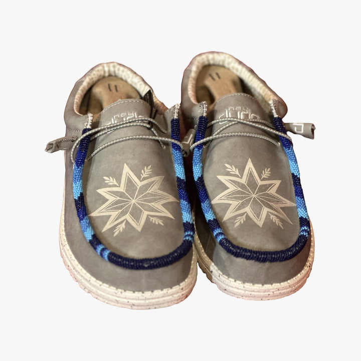 All Nations Designs &amp; More light gray Hey Dude slip-on shoes featuring custom blue and white hand-beaded star patterns.