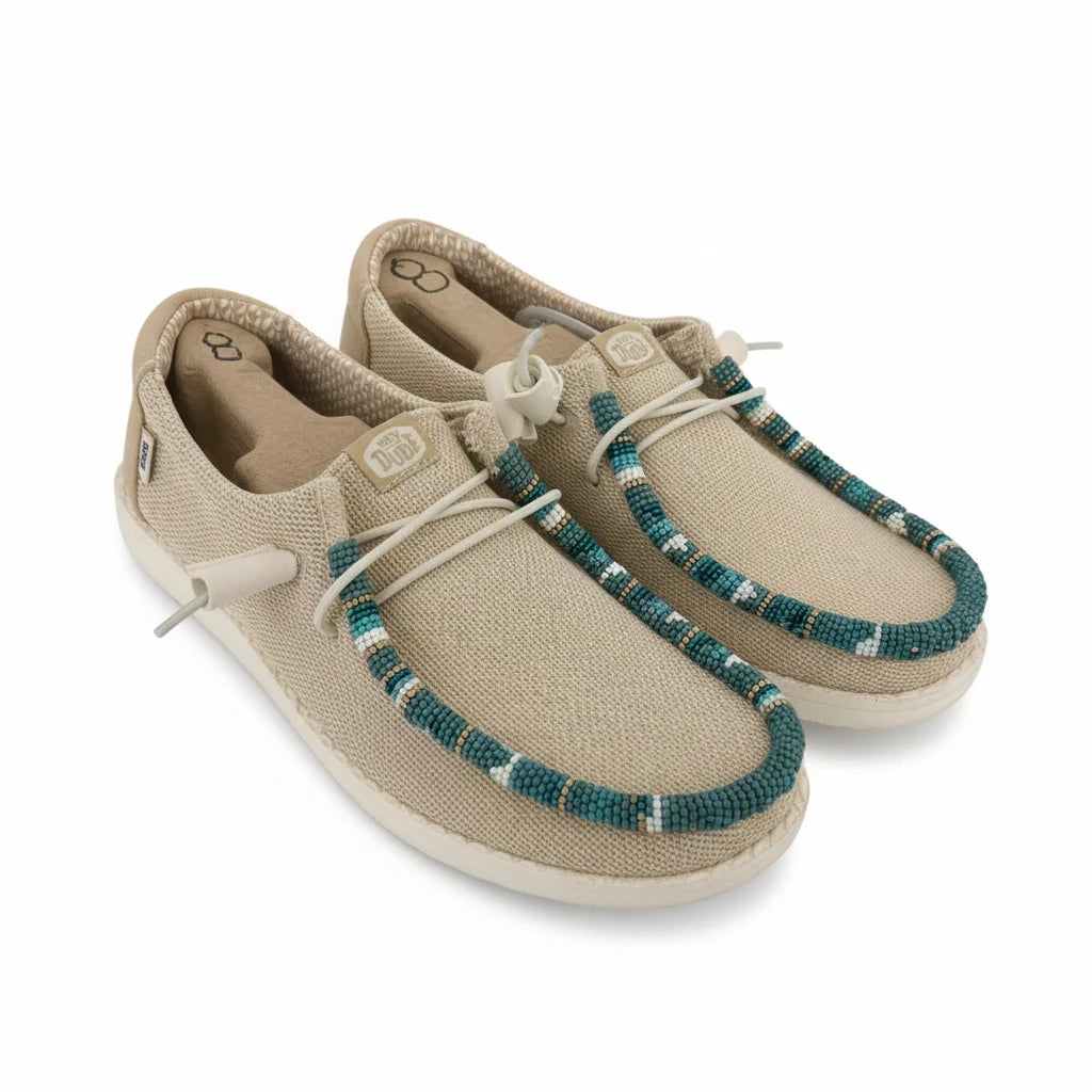 All Nations Designs &amp; More hand-beaded Hey Dude slip-on shoes in Irish cream mesh with turquoise beadwork accents.