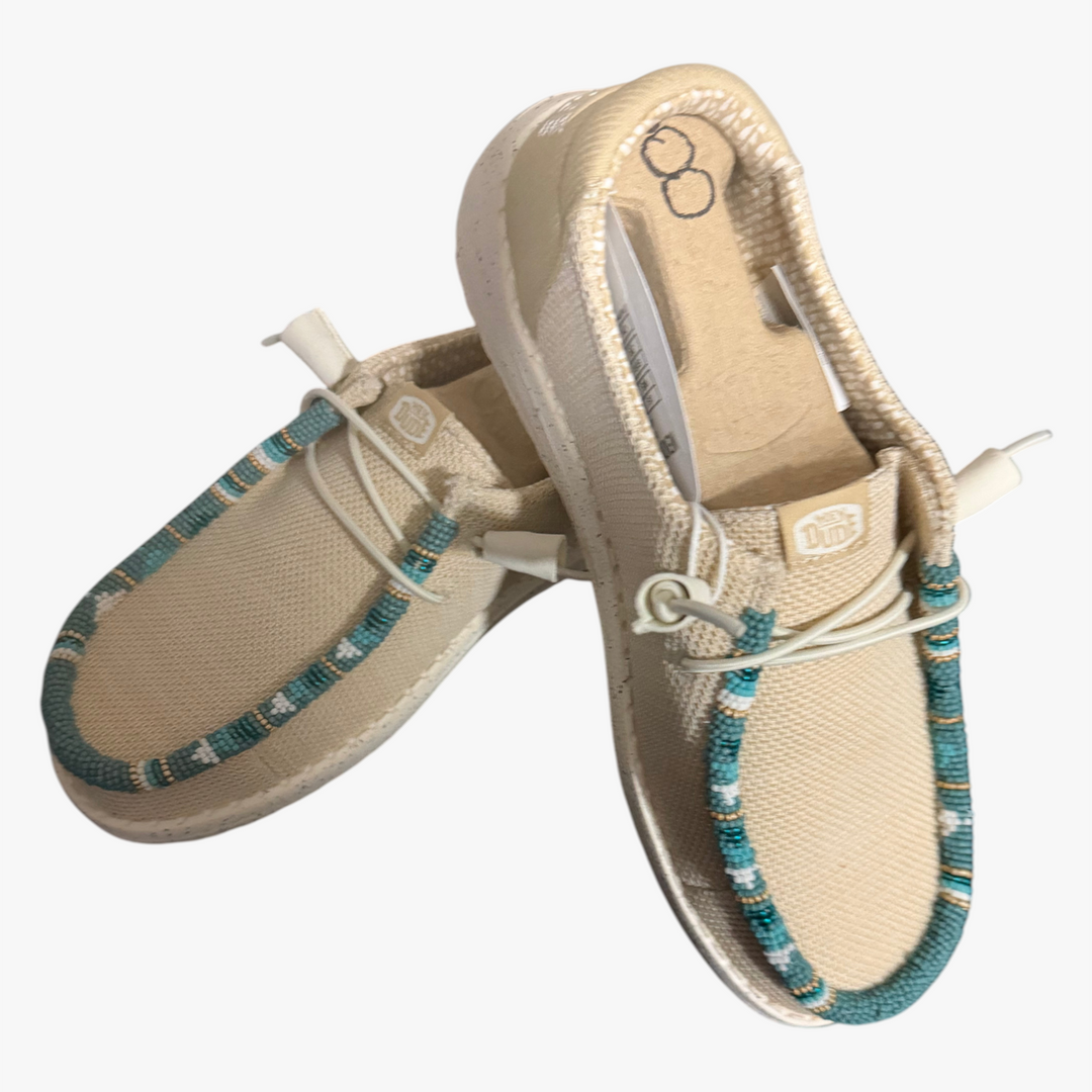 All Nations Designs &amp; More hand-beaded Hey Dude slip-on shoes in Irish cream mesh with turquoise beadwork accents.