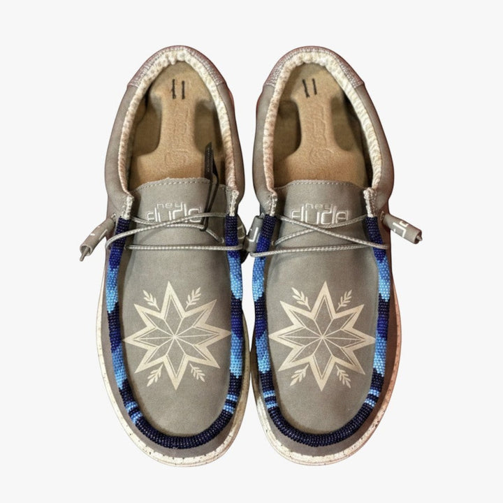 All Nations Designs &amp; More light gray Hey Dude slip-on shoes featuring custom blue hand-beaded star patterns.
