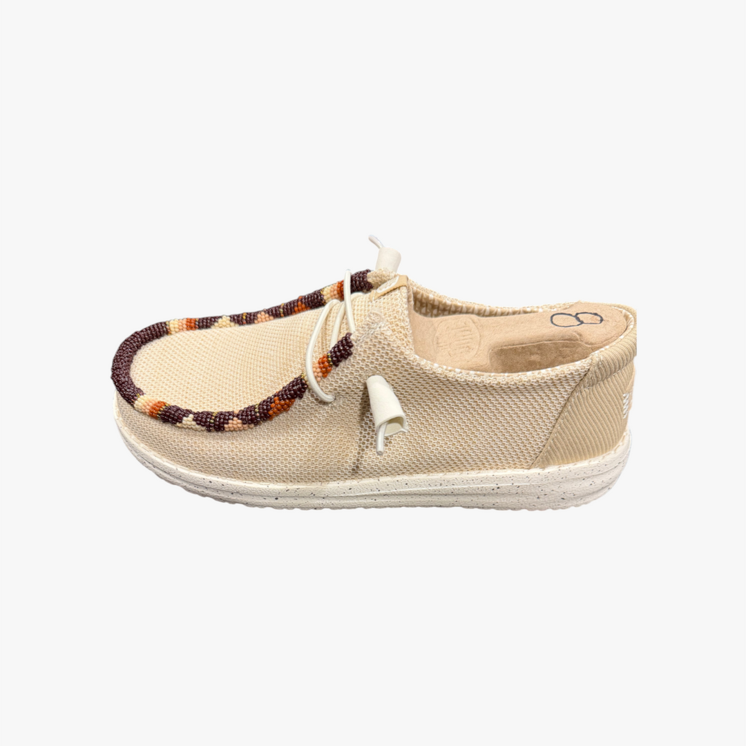 All Nations Designs &amp; More hand-beaded Hey Dude slip-on shoes in Irish Cream mesh with brown and orange bead accents.