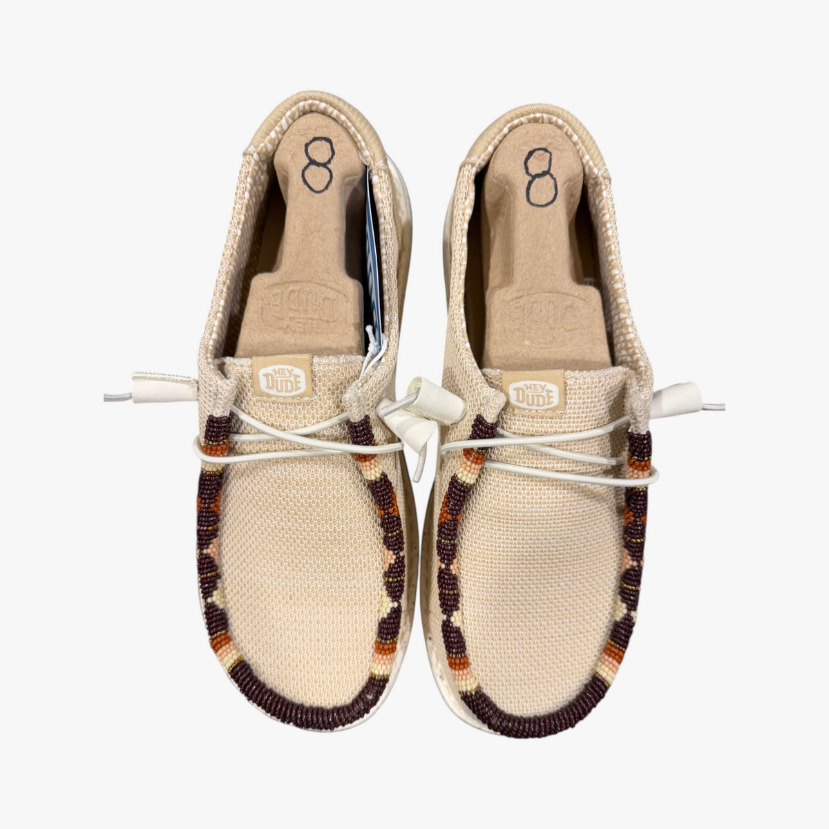 All Nations Designs & More hand-beaded Hey Dude slip-on shoes in Irish cream mesh with brown western beadwork.