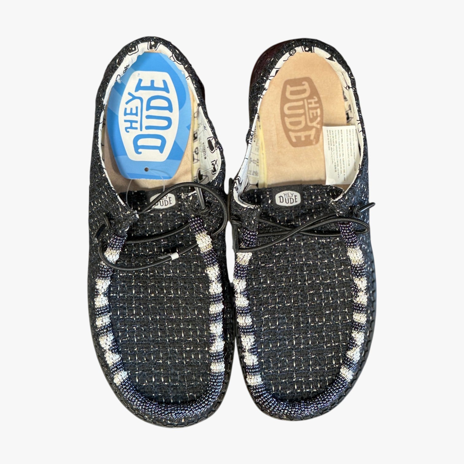 All Nations Designs & More black mesh Hey Dude slip-on shoes featuring unique hand-beaded detailing on the toe box.