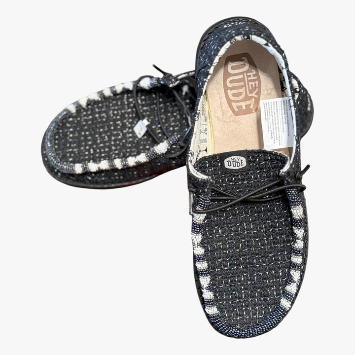 All Nations Designs &amp; More black mesh Hey Dude slip-on shoes featuring unique white and black hand-beaded detailing.
