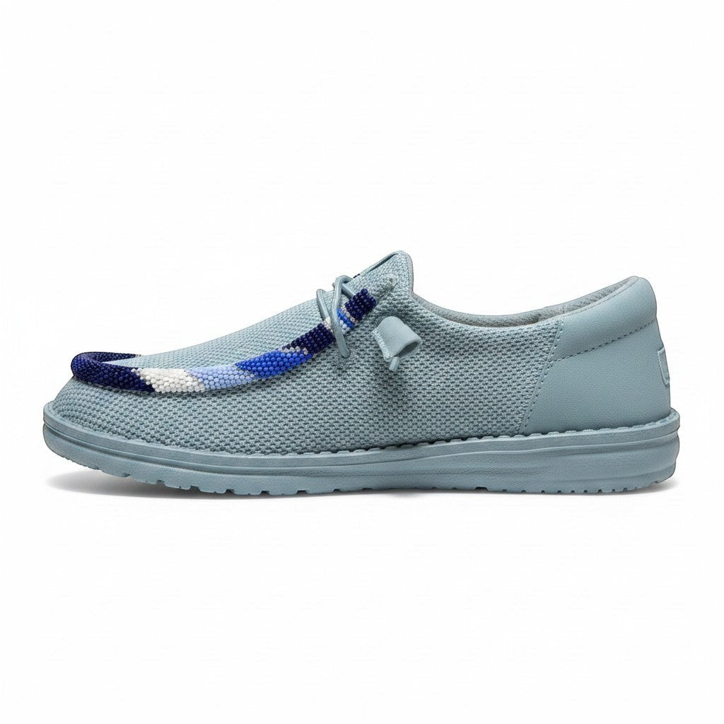 All Nations Designs &amp; More hand-beaded Hey Dude slip-on shoes in mesh tourmaline blue with custom beadwork detail.