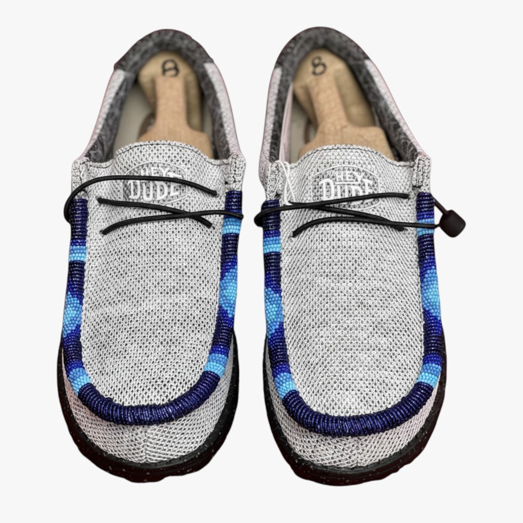 All Nations Designs & More light gray mesh Hey Dude slip-on shoes featuring unique blue and navy hand-beaded detailing.