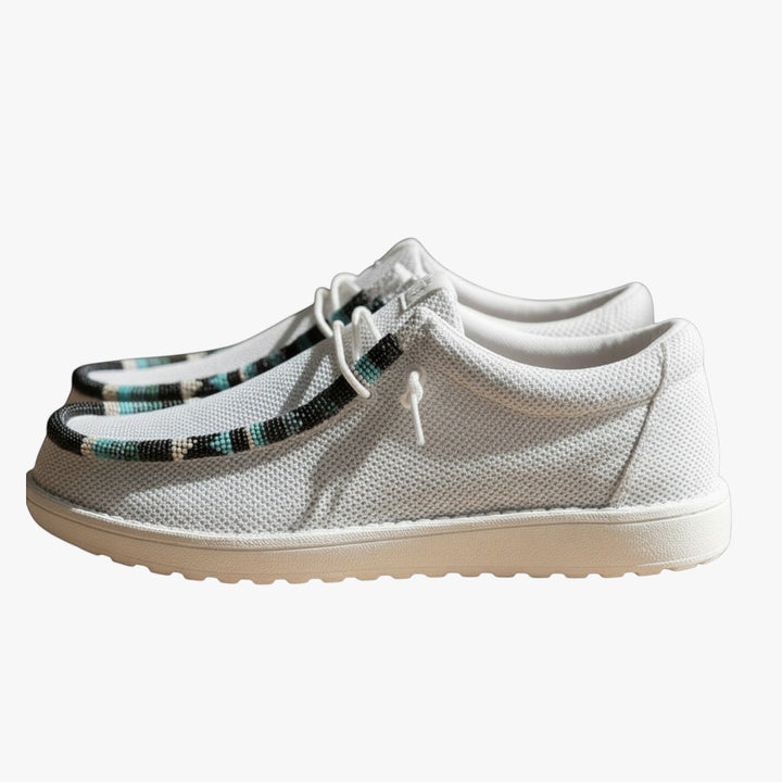 All Nations Designs &amp; More light gray mesh slip-on shoes featuring custom hand-beaded trim in a western-inspired style.