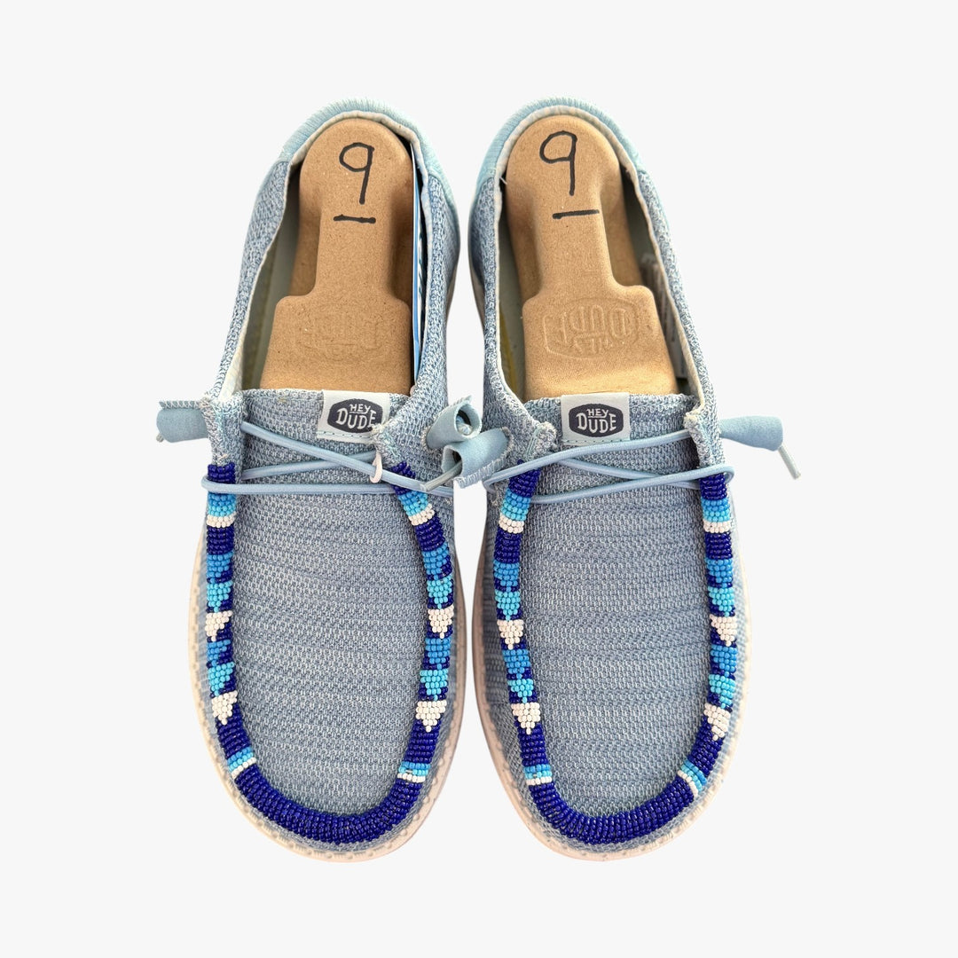 All Nations Designs &amp; More hand-beaded gray and blue mesh Hey Dude slip-on shoes with unique western-inspired beadwork.