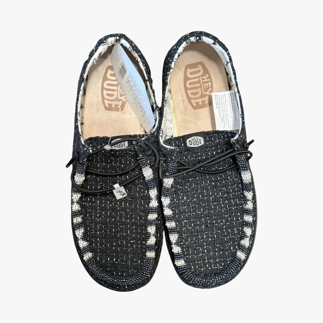All Nations Designs &amp; More hand-beaded black mesh Hey Dude slip-on shoes with white and black patterned beadwork.