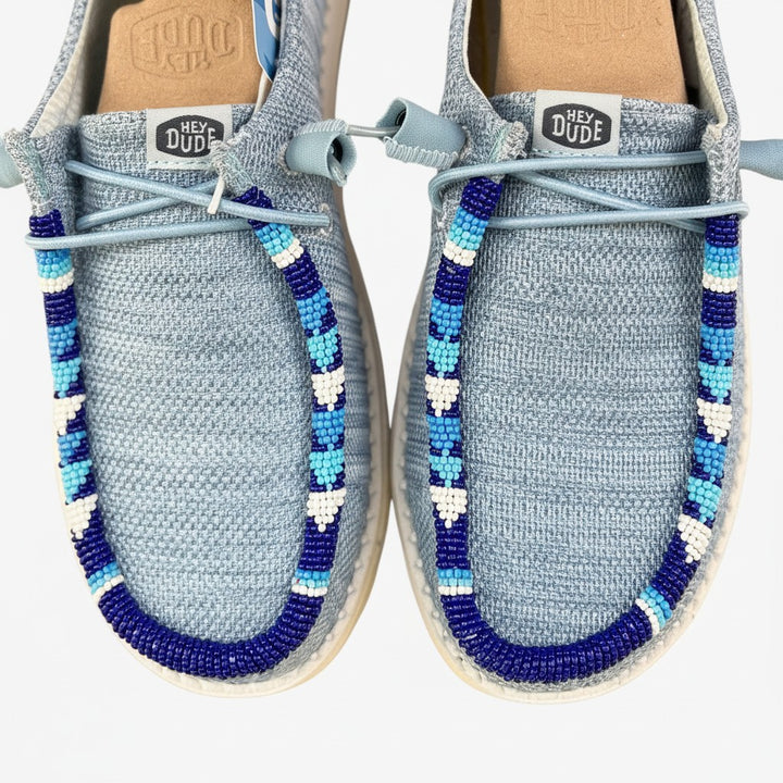All Nations Designs &amp; More gray and blue mesh Hey Dude slip-on shoes featuring custom hand-beaded trim details.