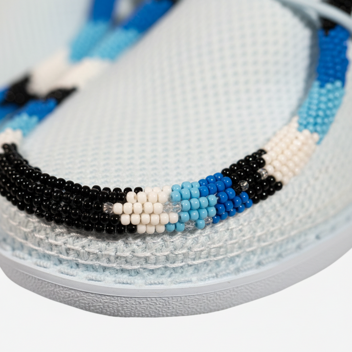 All Nations Designs &amp; More hand-beaded blue and black mesh slip-on shoes with intricate geometric beadwork detail