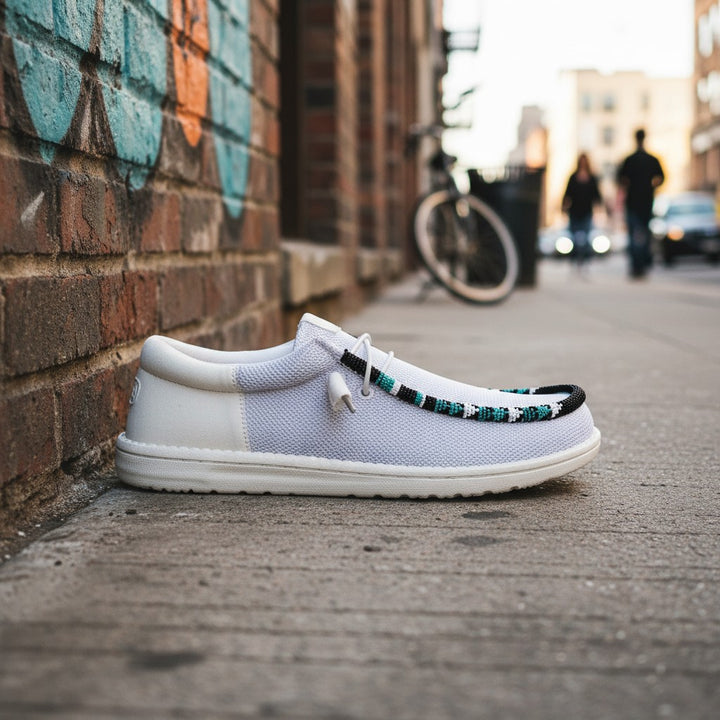 All Nations Designs &amp; More light gray mesh Hey Dude slip-on shoes featuring custom hand-beaded detailing on the side.