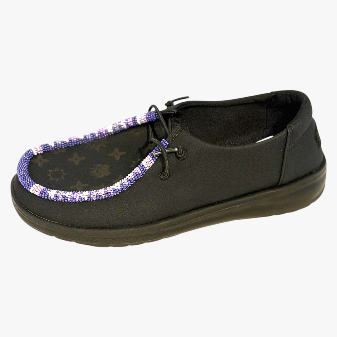 All Nations Designs &amp; More black Hey Dude slip-on shoes featuring custom purple and white hand-beaded Native Louie trim