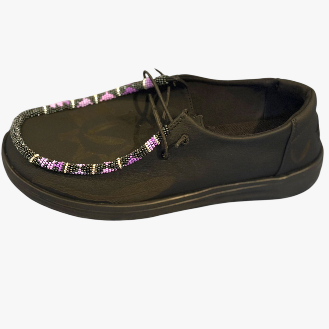 All Nations Designs &amp; More black leather Hey Dude slip-on shoes featuring unique hand-beaded teepee pattern detailing.