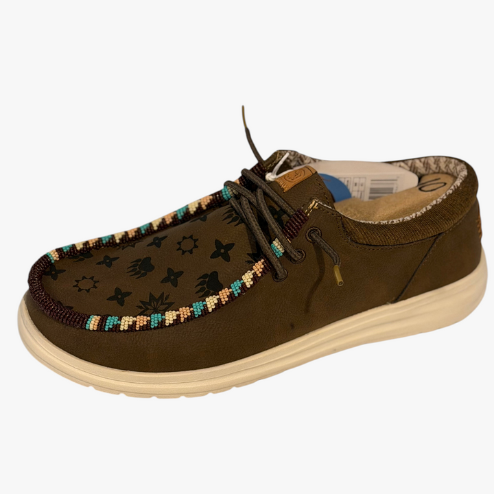 All Nations Designs &amp; More brown Hey Dude slip-on shoes featuring custom Native Louie hand-beaded trim and laser art.
