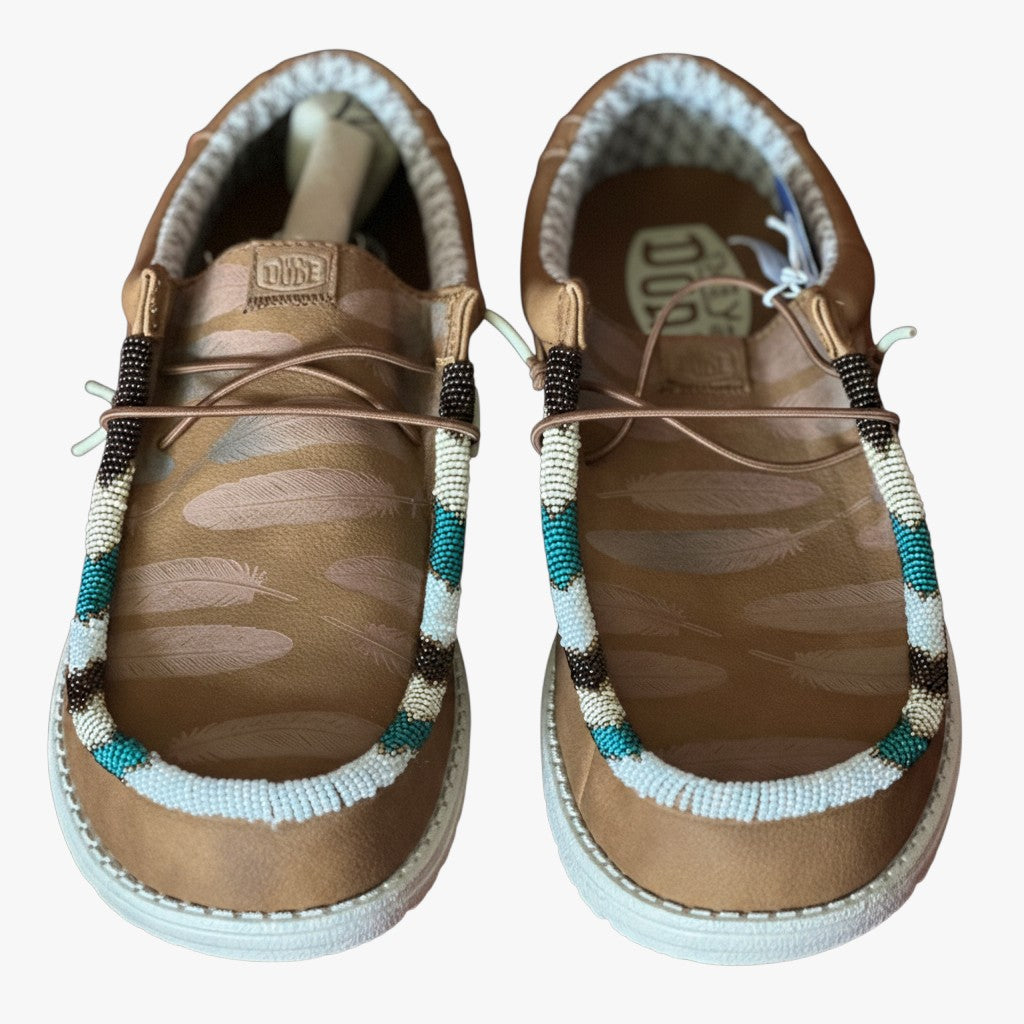 All Nations Designs & More men's brown Hey Dude slip-on shoes featuring custom hand-beaded turquoise and white trim.