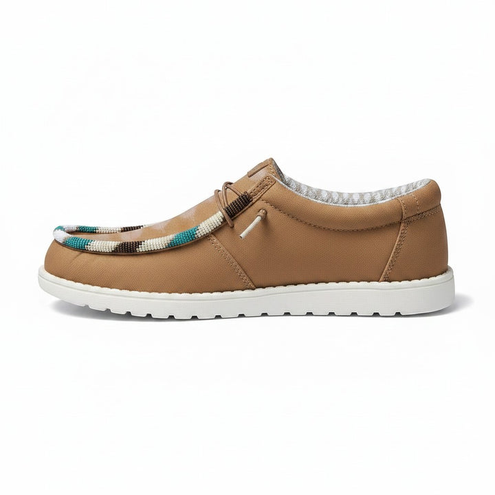 All Nations Designs &amp; More brown Hey Dude slip-on shoes featuring custom hand-beaded trim in a western-inspired style.