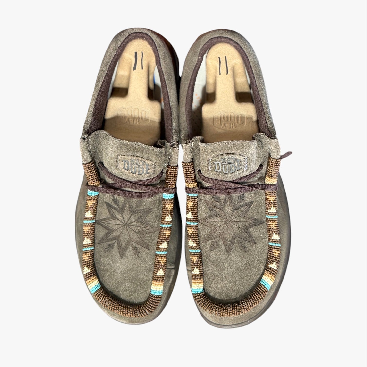All Nations Designs & More men's brown suede Hey Dude slip-on shoes featuring custom hand-beaded star patterns.