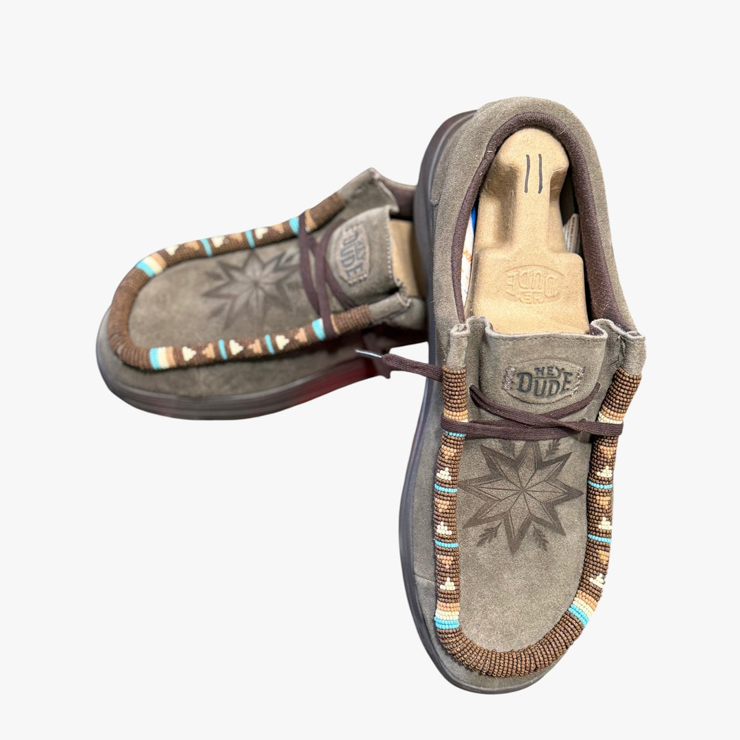 All Nations Designs &amp; More brown suede Hey Dude slip-on shoes featuring custom hand-beaded trim and laser-etched star.