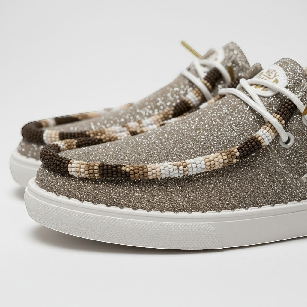 All Nations Designs &amp; More Hey Dude metallic gold sparkle slip-on shoes with intricate earthy hand-beaded trim.