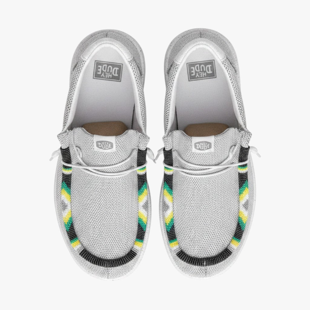 All Nations Designs & More men's gray mesh Hey Dude slip-on shoes featuring unique hand-beaded geometric patterns.