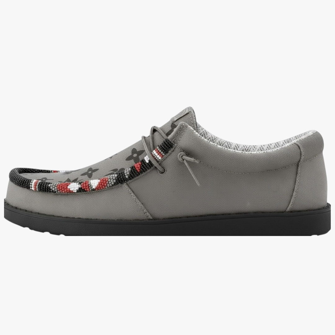 All Nations Designs &amp; More gray Hey Dude slip-on shoes featuring custom hand-beaded western patterns and paw prints.