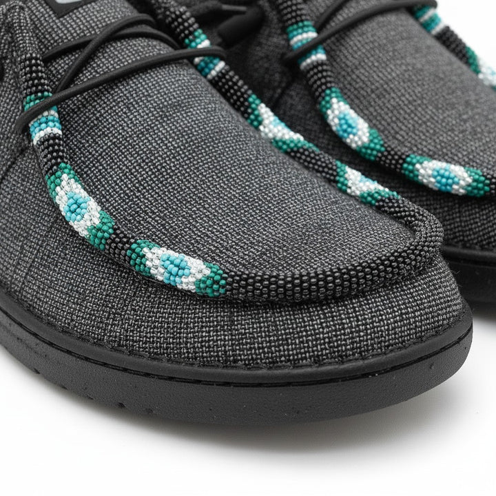 All Nations Designs &amp; More gray Hey Dude slip-on shoes featuring custom turquoise, black, and white hand-beaded trim.