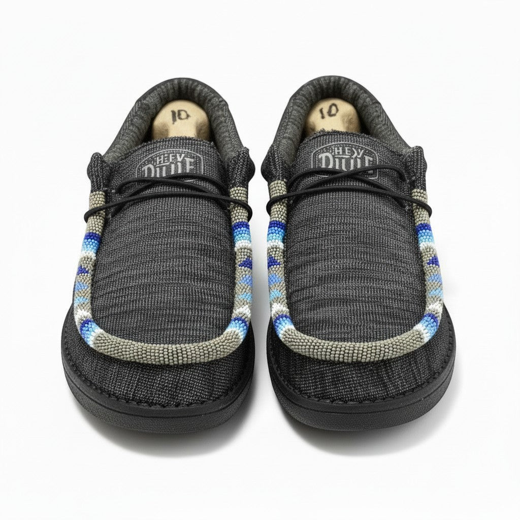 All Nations Designs &amp; More gray Hey Dude slip-on shoes featuring unique blue and white hand-beaded trim details.