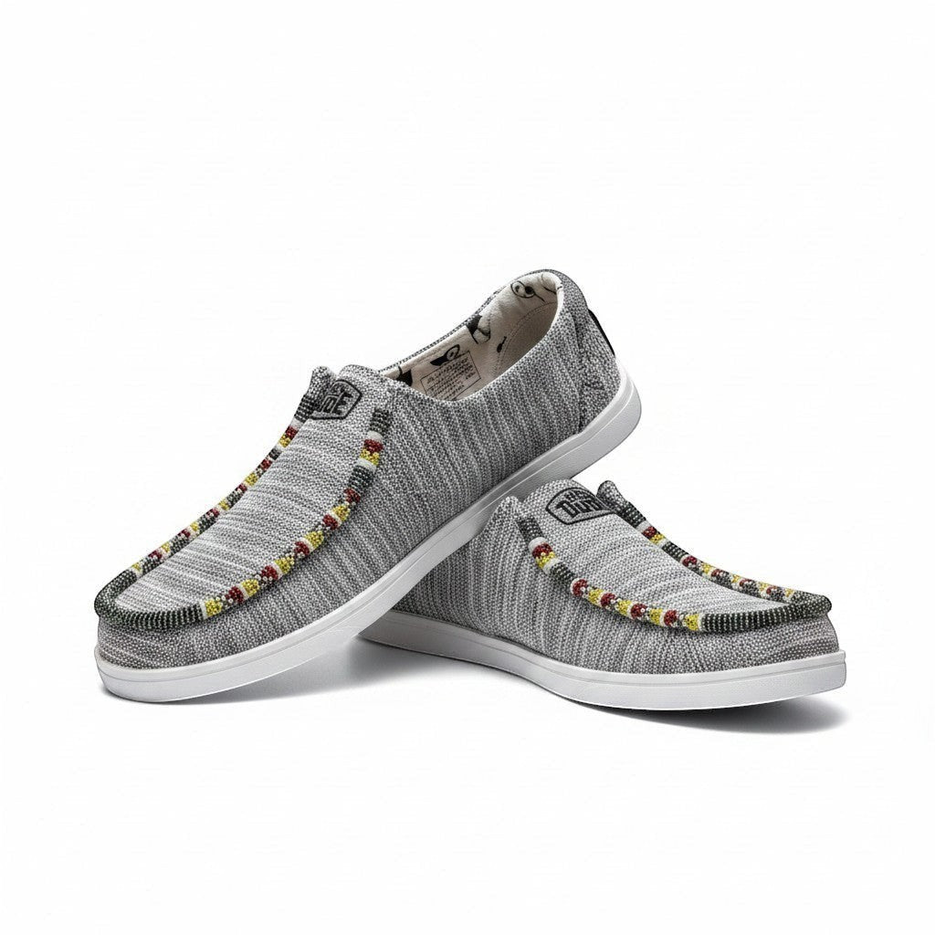 All Nations Designs &amp; More grey heather mesh Hey Dude slip-on shoes with intricate red and yellow hand-beaded trim.