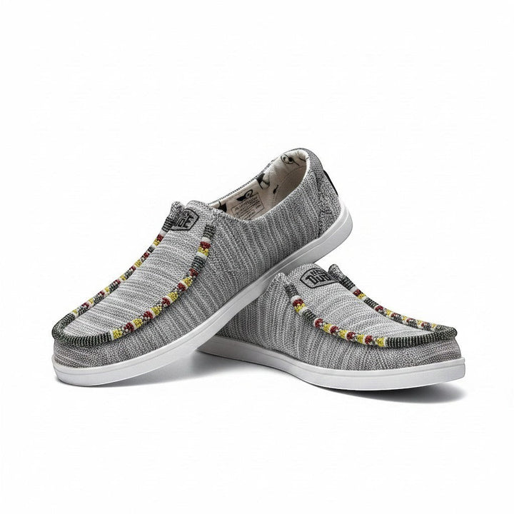 All Nations Designs &amp; More grey heather mesh Hey Dude slip-on shoes with intricate red and yellow hand-beaded trim.