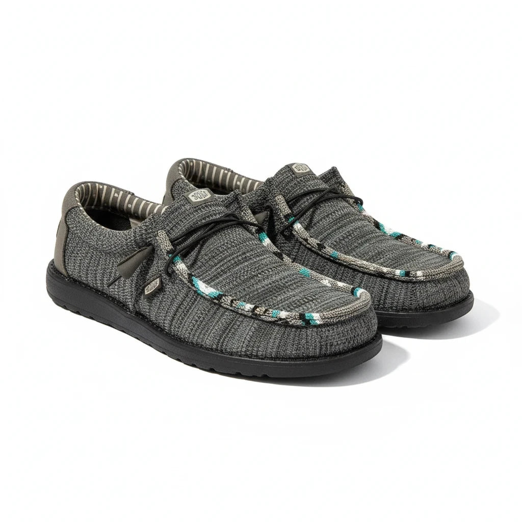 All Nations Designs &amp; More hand-beaded Hey Dude Wally Sox slip-on shoes in granite grey and black with western accents.