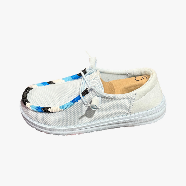 All Nations Designs &amp; More hand-beaded Hey Dude slip-on shoes in blue and black mesh, size 5, side view.