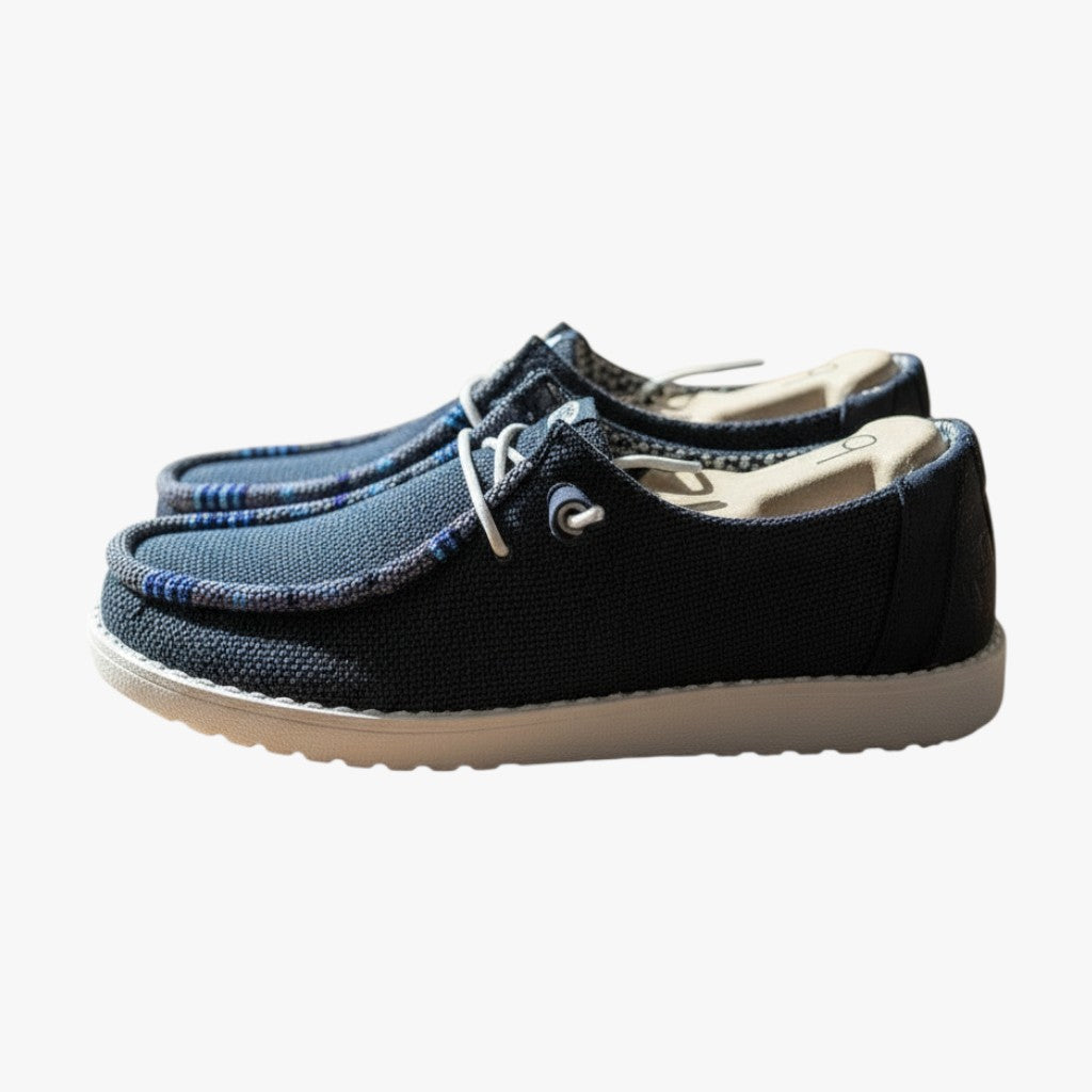 All Nations Designs &amp; More navy mesh Hey Dude slip-on shoes featuring unique hand-beaded detailing on a white sole.