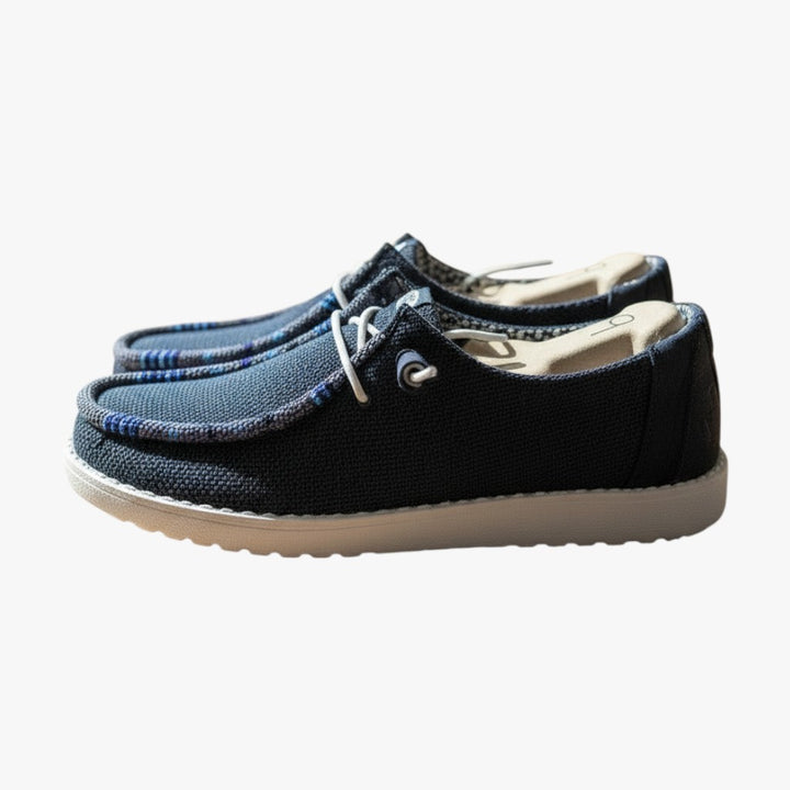 All Nations Designs &amp; More navy mesh Hey Dude slip-on shoes featuring unique hand-beaded detailing on a white sole.