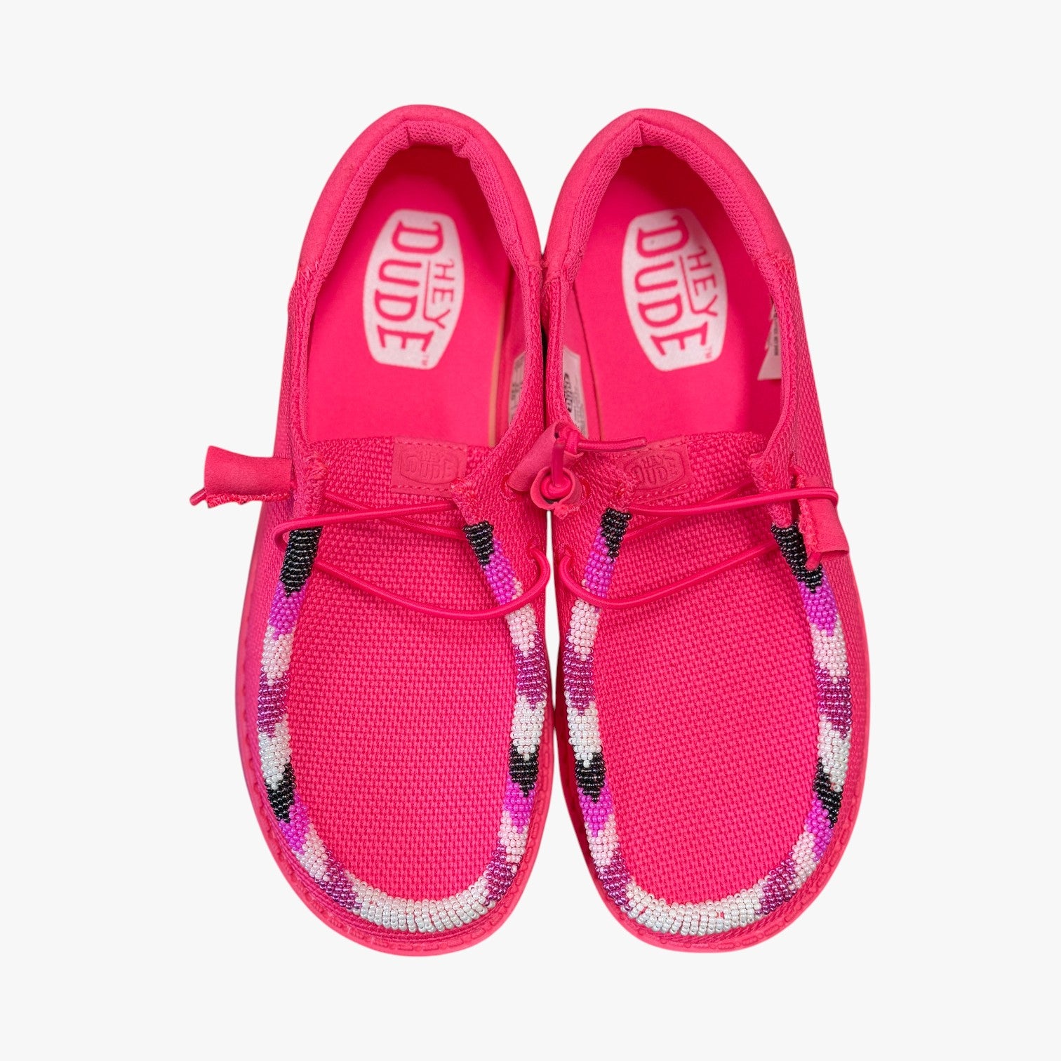 All Nations Designs & More electric pink Hey Dude slip-on shoes with custom hand-beaded detailing on the mesh upper.