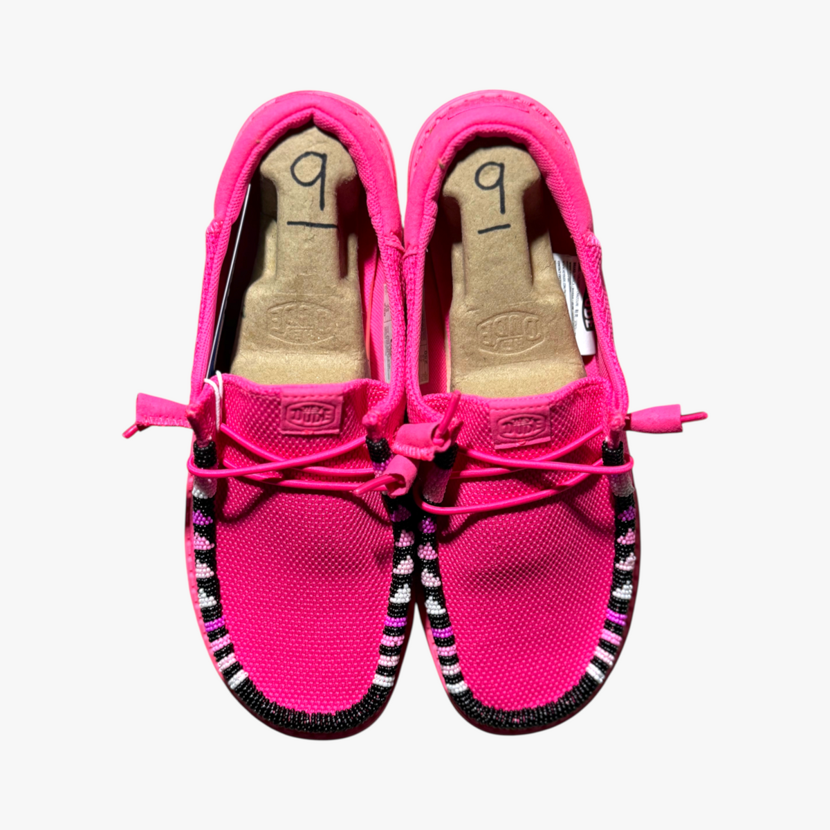 All Nations Designs & More electric pink Hey Dude slip-on shoes featuring custom hand-beaded trim details.